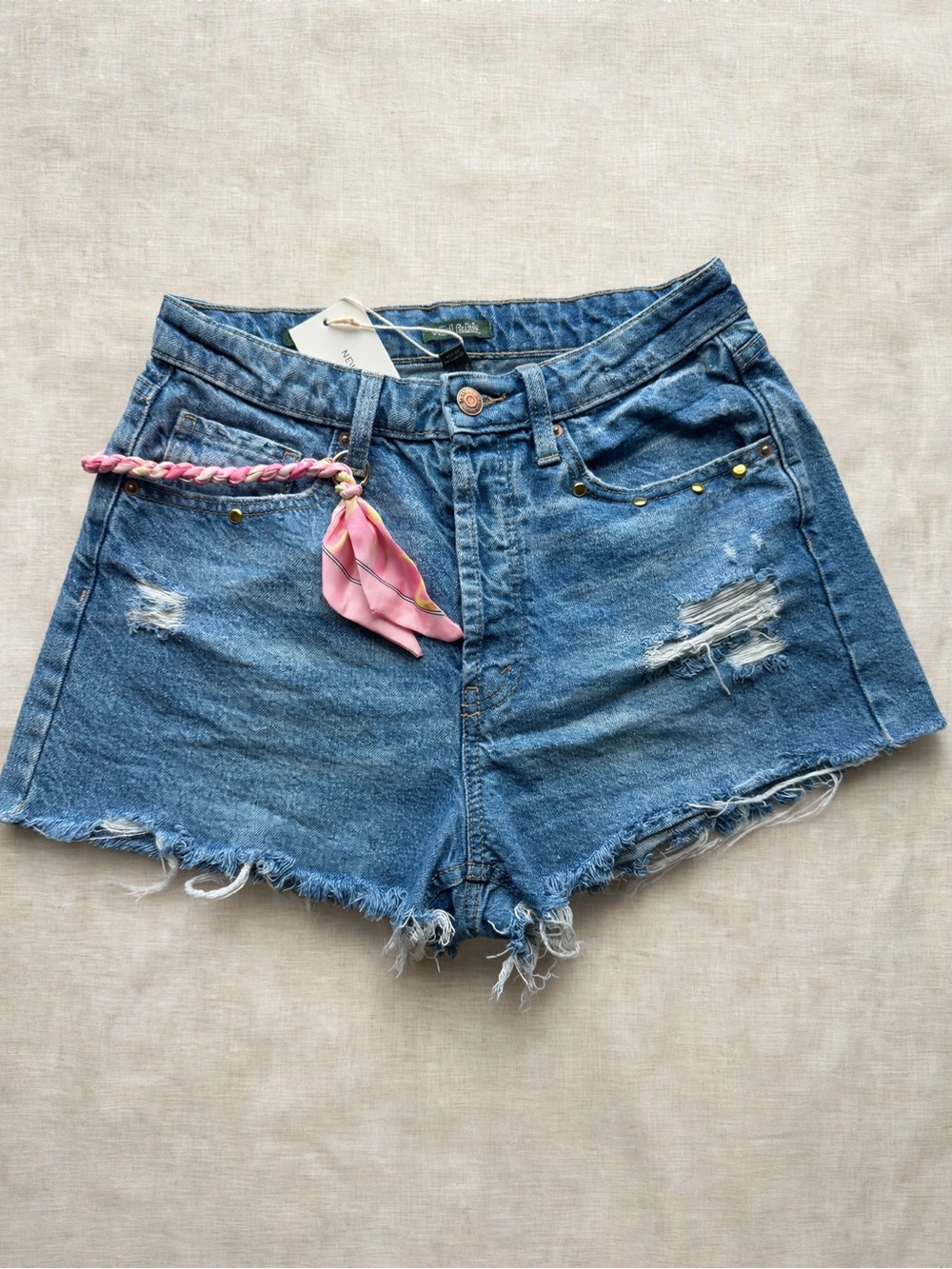 Women’s Distressed Blue Denim Shorts with Pink Scarf Accent